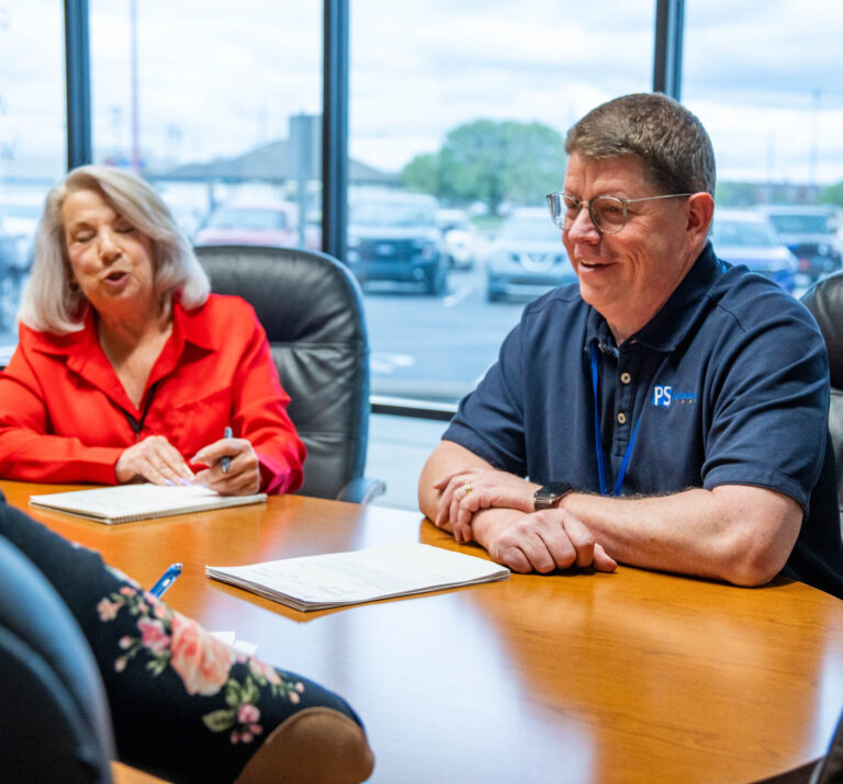 The Print Source Team in a meeting.