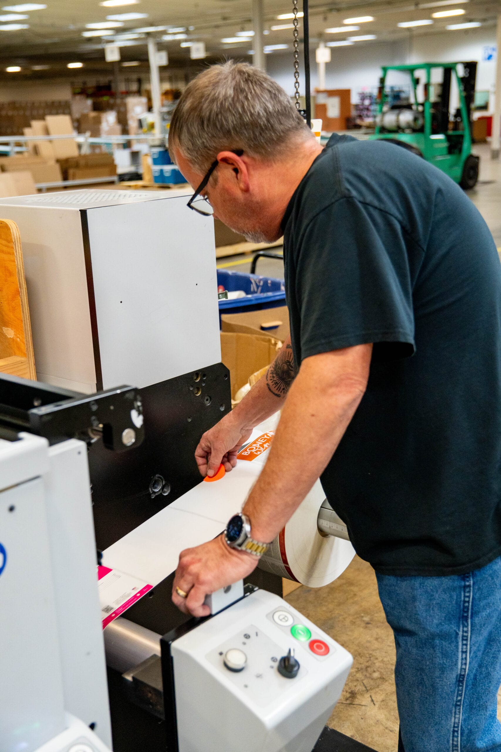 Employee working on print job.