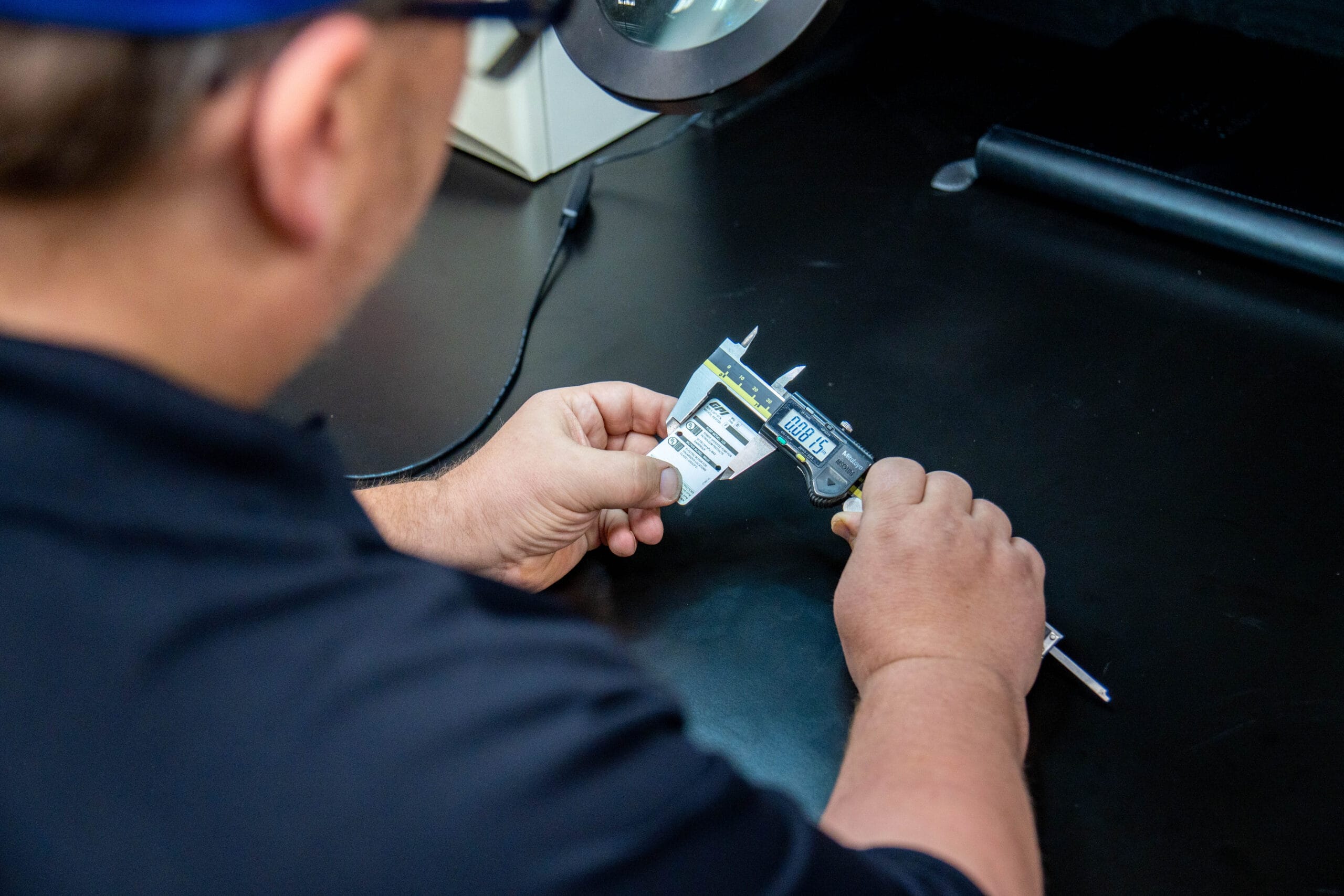 Checking measurements on printed materials.