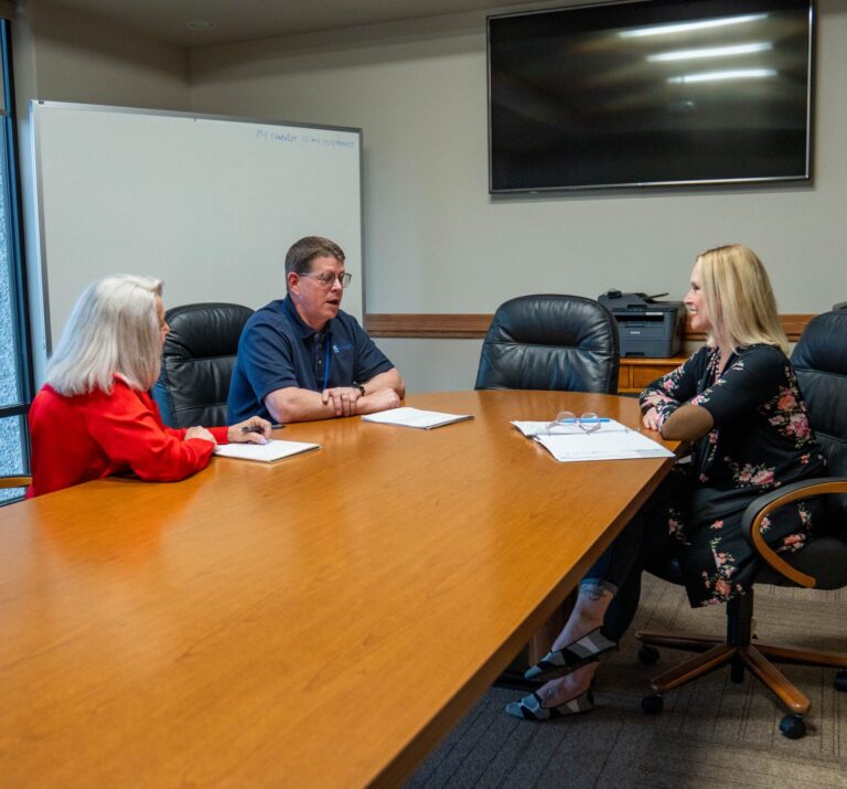 Print Source Staff in a meeting.
