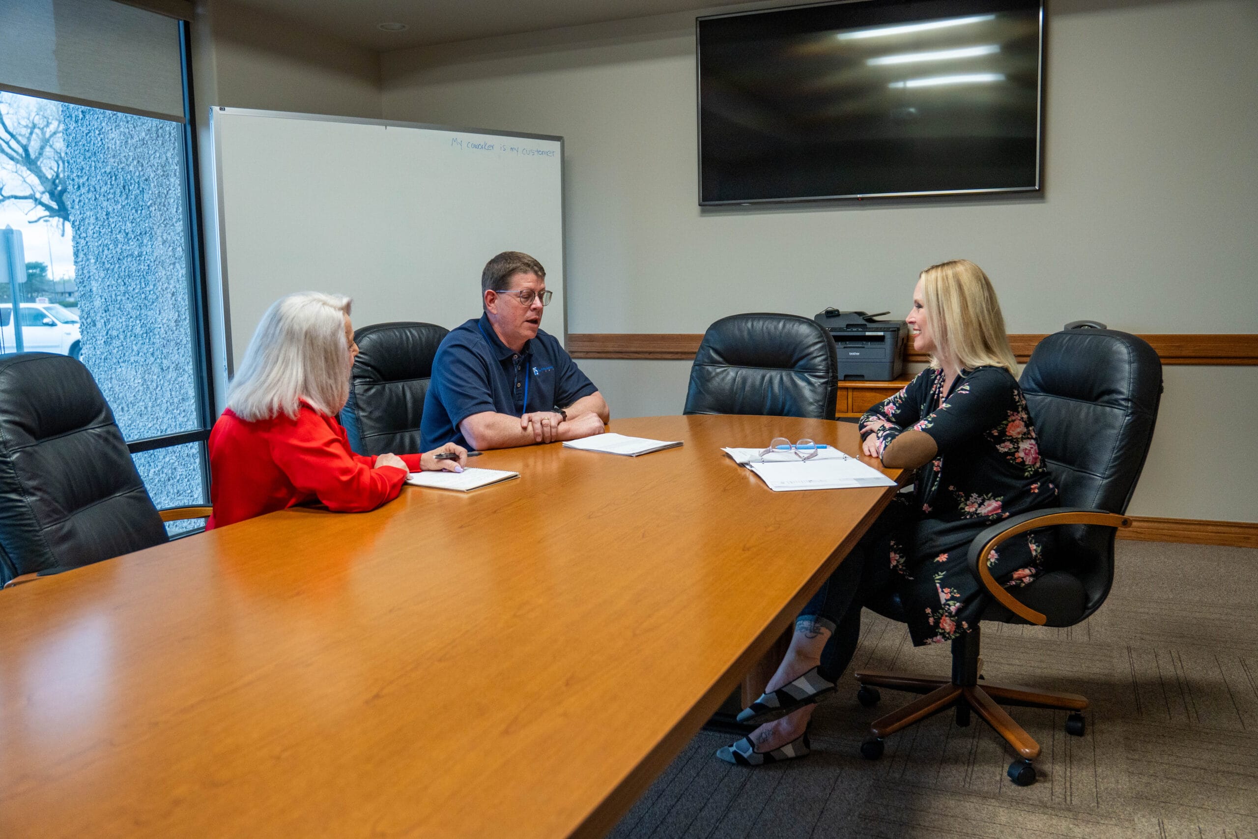 Print Source Staff in a meeting.