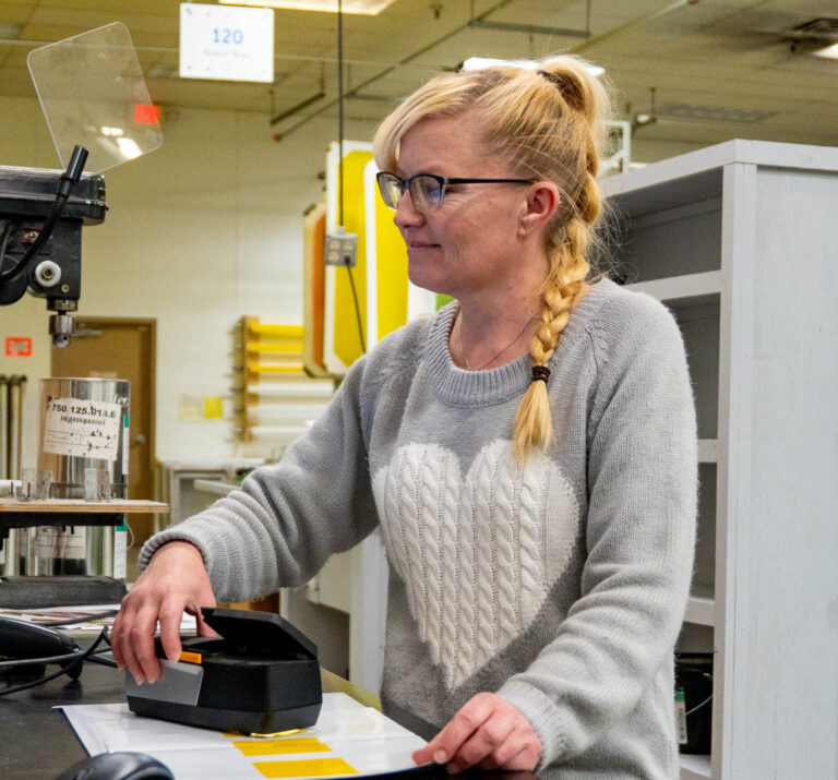 Print Source employee working on an order.