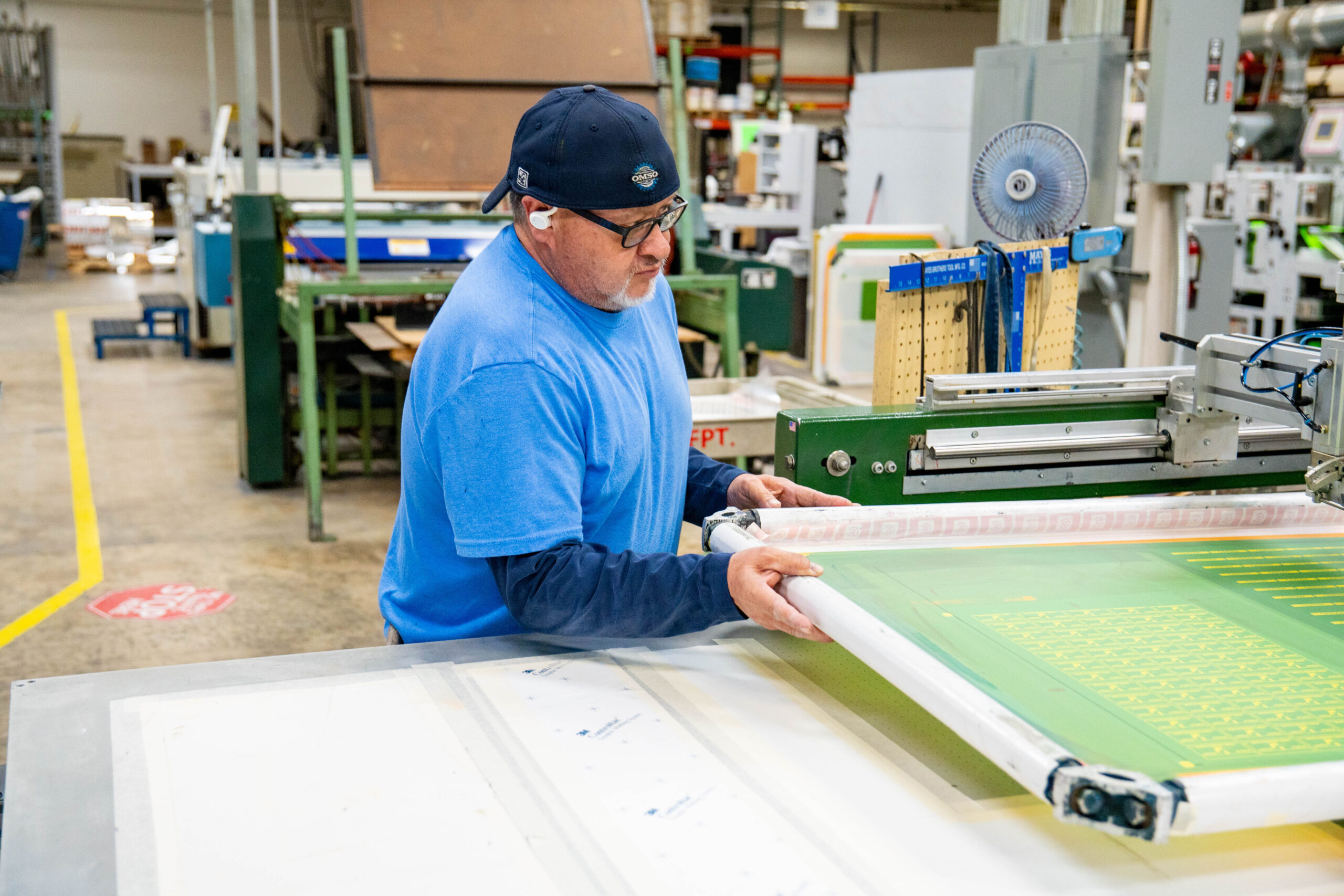 Print Source employee working on a custom print order.