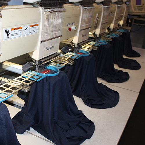 machines embroidering polos